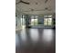 Bright yoga room featuring large windows, ceiling fans, and natural light at 14553 Eagle Branch Dr, Nokomis, FL 34275