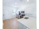 Clean, bright kitchen featuring white cabinets and stainless steel appliances at 8540 Daybreak St, Sarasota, FL 34241