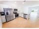 Bright modern kitchen with stainless steel appliances and white cabinetry at 8540 Daybreak St, Sarasota, FL 34241