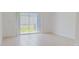 Open living room with sliding glass doors leading to a private backyard at 8540 Daybreak St, Sarasota, FL 34241