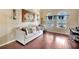 Bright living room with hardwood floors and comfortable seating at 6932 Gray Catbird Loop, Wesley Chapel, FL 33545