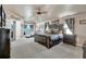 Spacious main bedroom suite featuring a seating area and decorative accents at 6932 Gray Catbird Loop, Wesley Chapel, FL 33545
