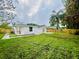 The property features a covered patio and outdoor space, perfect for enjoying the outdoors at 801 Leeward Way, Palm Harbor, FL 34685