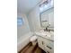 Renovated bathroom with modern fixtures, and tub with shower at 801 Leeward Way, Palm Harbor, FL 34685