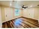 Cozy bedroom showcasing wood-look floors, recessed lighting, and two convenient closets at 801 Leeward Way, Palm Harbor, FL 34685