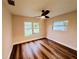 Bedroom with hardwood floors and a ceiling fan at 801 Leeward Way, Palm Harbor, FL 34685