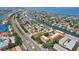 Panoramic aerial view of waterfront community with canals, lush landscaping, and nearby ocean access at 1061 Pinellas Bayway S, Tierra Verde, FL 33715
