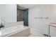 Spacious bathroom featuring a relaxing soaking tub and separate glass shower at 1061 Pinellas Bayway S, Tierra Verde, FL 33715
