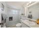 Well-maintained bathroom features a shower, modern sink, and storage options at 1061 Pinellas Bayway S, Tierra Verde, FL 33715