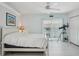 Bedroom featuring a ceiling fan, and access to a balcony at 1061 Pinellas Bayway S, Tierra Verde, FL 33715