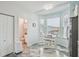 Inviting breakfast nook with a powder room and a bay window overlooking the neighborhood at 1061 Pinellas Bayway S, Tierra Verde, FL 33715