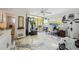 Bright exercise room with gym equipment, desk, and balcony access, featuring modern epoxy flooring at 1061 Pinellas Bayway S, Tierra Verde, FL 33715