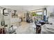 Spacious exercise room with workout equipment, a desk, and a balcony with natural light at 1061 Pinellas Bayway S, Tierra Verde, FL 33715