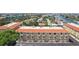 Charming condo exterior with garages, well-kept facade, and mature landscaping at 1061 Pinellas Bayway S, Tierra Verde, FL 33715