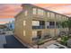 Multi-story condo building with balconies, ample windows, and well-maintained landscaping on a sunny day at 1061 Pinellas Bayway S, Tierra Verde, FL 33715