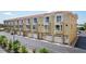 Charming townhome row with attached garages, balconies, and well-maintained exteriors at 1061 Pinellas Bayway S, Tierra Verde, FL 33715