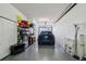 Organized garage space with vehicle, storage shelves, and ample room for parking and storage at 1061 Pinellas Bayway S, Tierra Verde, FL 33715