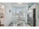 Breakfast nook boasts beautiful natural light from bay windows and stainless steel refrigerator at 1061 Pinellas Bayway S, Tierra Verde, FL 33715