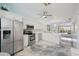 Bright, open kitchen features stainless steel appliances, white cabinetry, and durable, easy-to-clean floors at 1061 Pinellas Bayway S, Tierra Verde, FL 33715