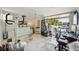 Bright room featuring a bed, gym equipment, and sliding glass doors to the outside creates a versatile space at 1061 Pinellas Bayway S, Tierra Verde, FL 33715