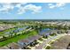 Community aerial view highlighting the ponds, lush green spaces, and meticulously maintained landscaping at 3255 Hilltop Cir, Bradenton, FL 34211