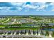 Panoramic aerial view of the community featuring ponds, manicured lawns, and beautiful landscaping at 3255 Hilltop Cir, Bradenton, FL 34211