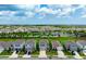 Aerial view of the home and community with landscaped lawns, ponds, and scenic surroundings at 3255 Hilltop Cir, Bradenton, FL 34211