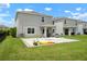 Expansive backyard showcasing a gray stone patio, perfect for outdoor entertaining at 3255 Hilltop Cir, Bradenton, FL 34211