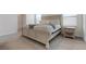 Bright bedroom showcasing carpet, a comfortable bed, and natural light at 3255 Hilltop Cir, Bradenton, FL 34211