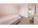 Bright bedroom featuring neutral walls and carpeting and simple furnishings at 3255 Hilltop Cir, Bradenton, FL 34211