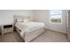 Cozy bedroom with natural light, neutral walls, carpet, and a comfortable bed, creating a relaxing space at 3255 Hilltop Cir, Bradenton, FL 34211
