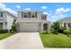 Beautiful home with a well-maintained lawn and an attached two-car garage at 3255 Hilltop Cir, Bradenton, FL 34211