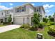 Charming two-story home with a manicured lawn and beautiful stone accents at 3255 Hilltop Cir, Bradenton, FL 34211