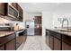 Modern kitchen featuring stainless steel appliances and granite countertops at 3255 Hilltop Cir, Bradenton, FL 34211