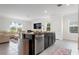 Modern kitchen with granite countertops, stainless appliances, and an island with a sink at 3255 Hilltop Cir, Bradenton, FL 34211