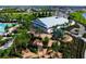 Birds eye view of resort style pool area surrounded by lush landscaping and pavers at 3255 Hilltop Cir, Bradenton, FL 34211