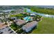 High angle view of a resort-style pool featuring palm trees, sun loungers, and other outdoor recreation facilities at 3255 Hilltop Cir, Bradenton, FL 34211