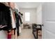 Spacious walk-in closet featuring ample storage with shelving and hanging rods at 3255 Hilltop Cir, Bradenton, FL 34211