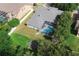 Aerial view showcasing the backyard featuring a screened-in pool and patio area at 4428 Winding River Drive, Valrico, FL 33596