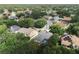 Aerial view of a single-Gathering home in a tree-filled neighborhood at 4428 Winding River Drive, Valrico, FL 33596