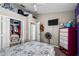 A bedroom showcasing a large closet, TV, and dresser at 4428 Winding River Drive, Valrico, FL 33596