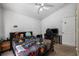 Bedroom furnished with gamer-themed bedding, a black desk, and neutral paint colors at 4428 Winding River Drive, Valrico, FL 33596