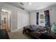 Bedroom with a view of the pool, features a double closet for ample storage space at 4428 Winding River Drive, Valrico, FL 33596