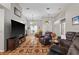 Spacious living room with decorative floors, high ceilings, and plenty of comfortable seating at 4428 Winding River Drive, Valrico, FL 33596