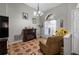 Cozy living room featuring decorative floors, electric fireplace, and a large window for natural light at 4428 Winding River Drive, Valrico, FL 33596