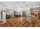 Open living room showcases unique tile flooring, dining area, kitchen bar, and neutral paint at 4428 Winding River Drive, Valrico, FL 33596