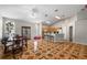 The open-concept living area includes a dining space and kitchen bar, creating a spacious atmosphere at 4428 Winding River Drive, Valrico, FL 33596