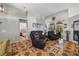 Spacious living room featuring tile flooring, comfortable seating, and view to the pool at 4428 Winding River Drive, Valrico, FL 33596