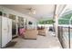 Spacious screened-in patio for outdoor living, including comfortable seating, dining, and a pool view at 4428 Winding River Drive, Valrico, FL 33596