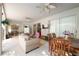 Spacious screened-in patio with comfortable seating, a dining area, and an outdoor view at 4428 Winding River Drive, Valrico, FL 33596
